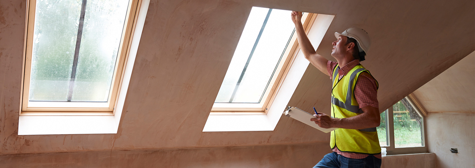 contractor looking at windows in home