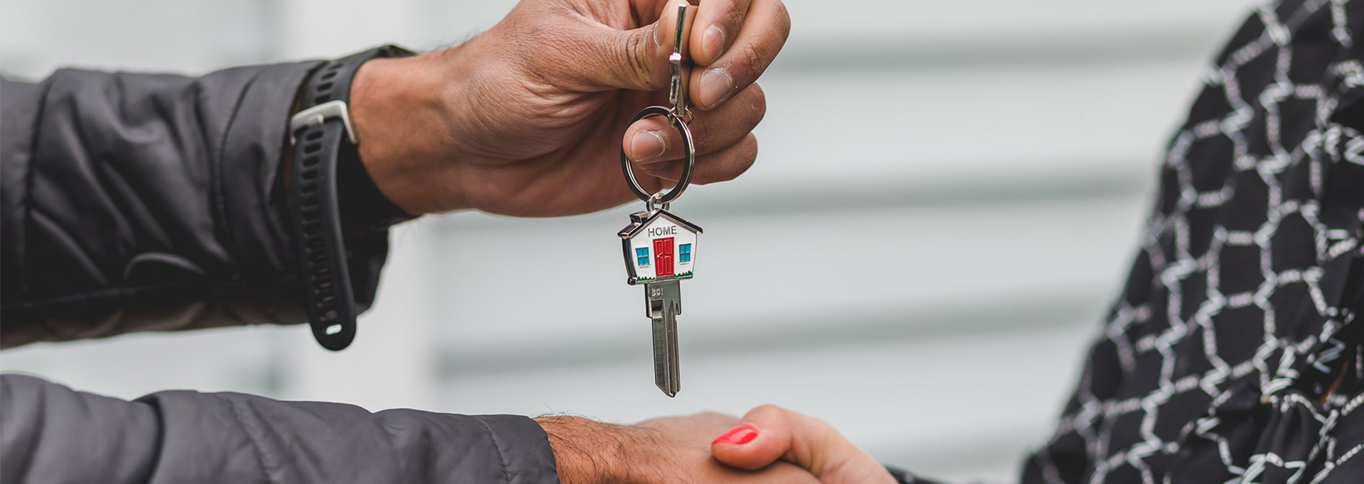 handing over key to home