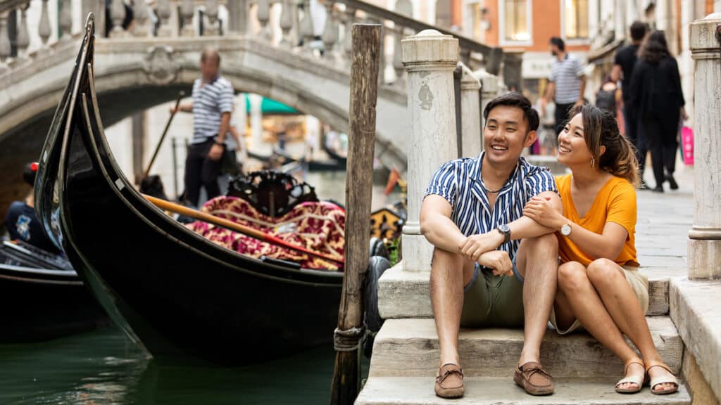 couple in venice next to gondola