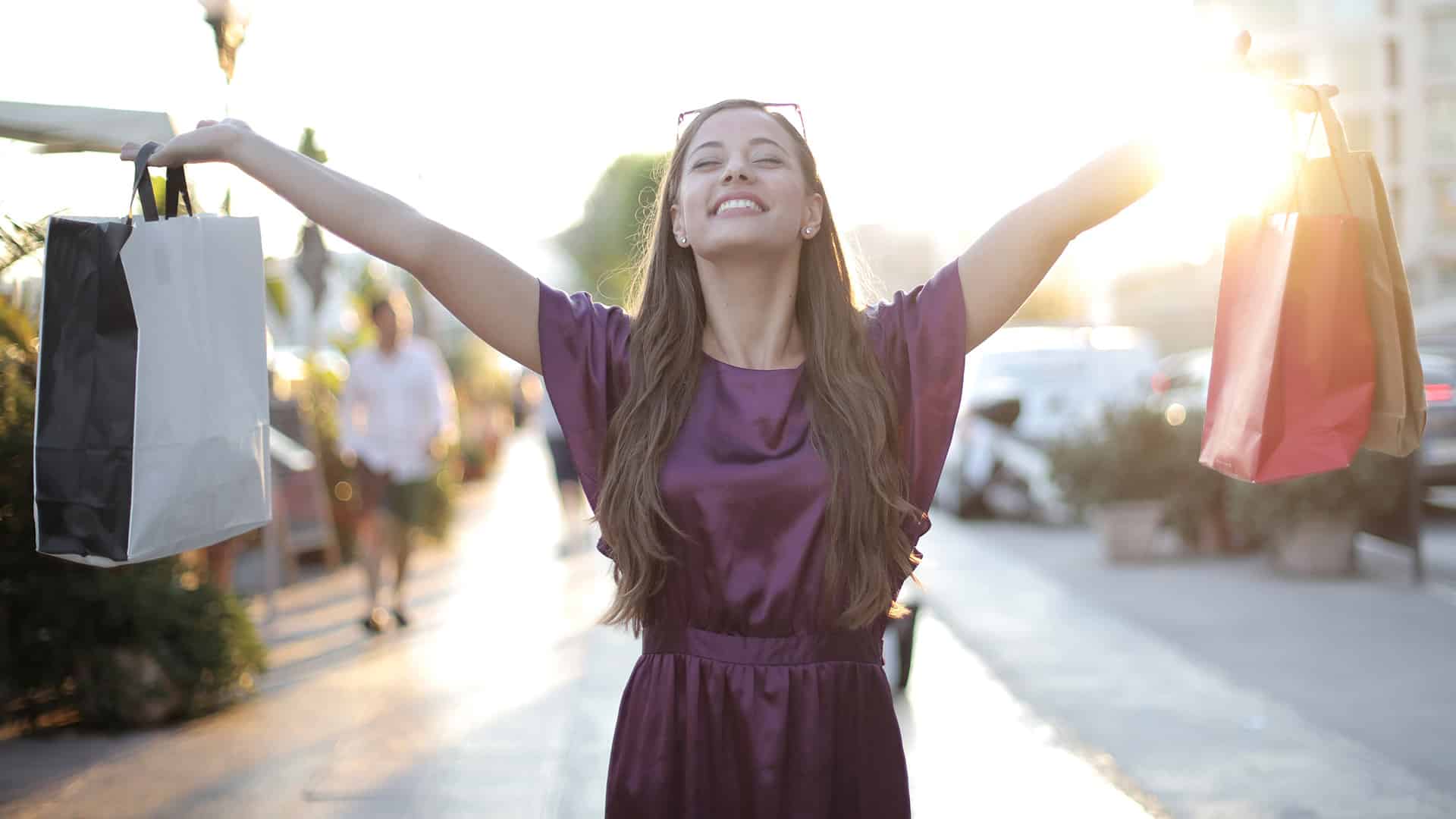 happy woman holding shopping bags