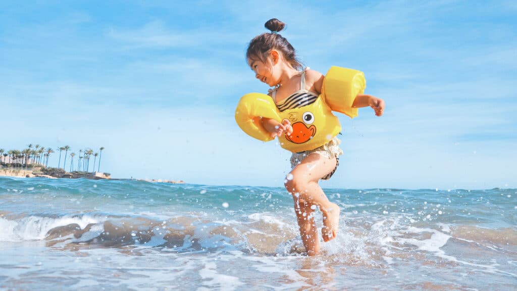 girl playing on the beach