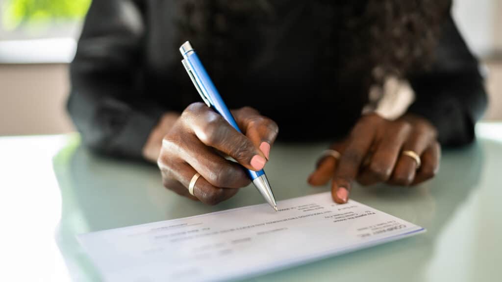 woman writing a check