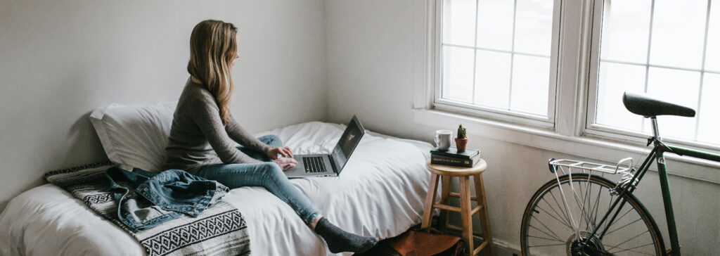 woman in apartment on computer