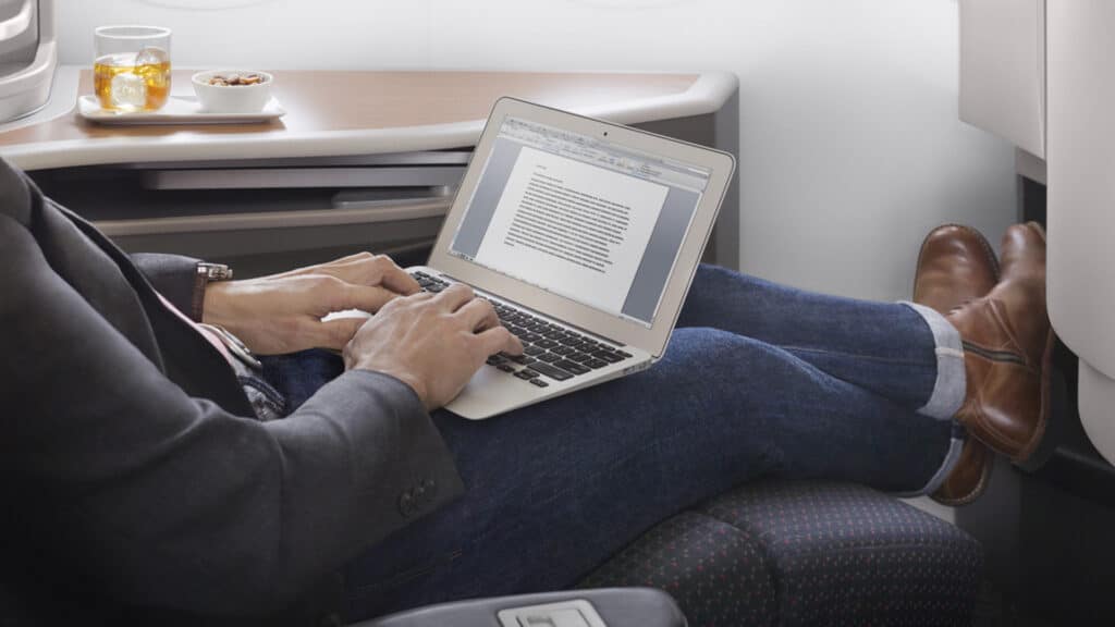 man in first class using wifi for business