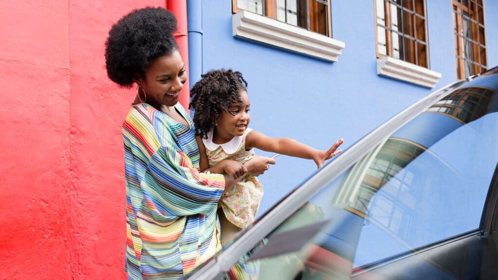 mother and child getting into Uber