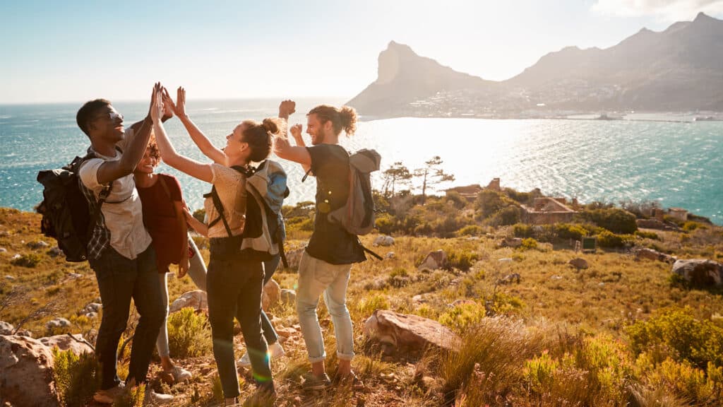 friends high five on vacation