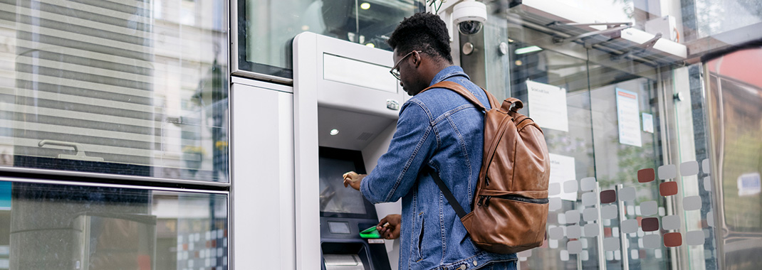 man banking at atm