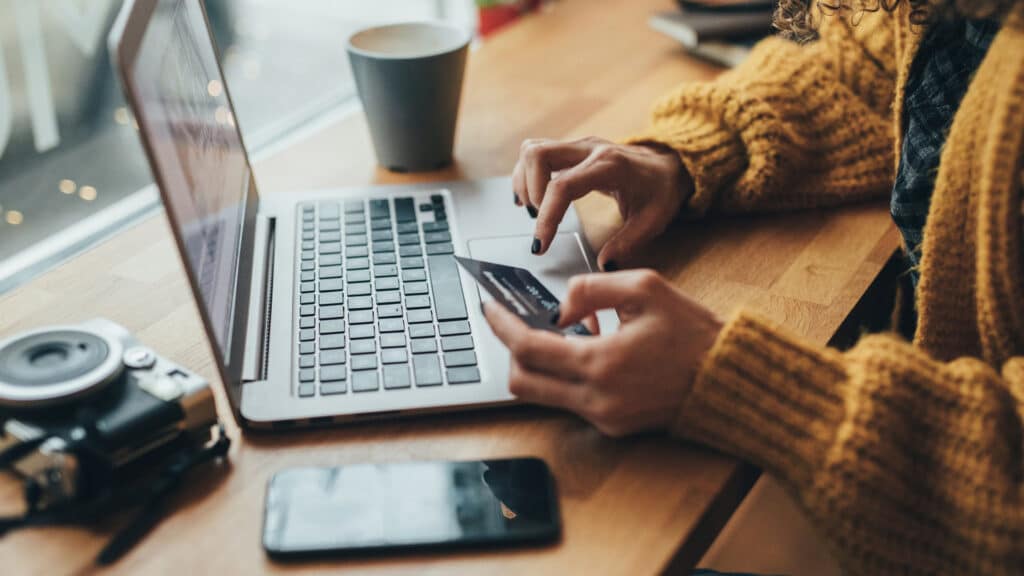 woman shopping online with credit card