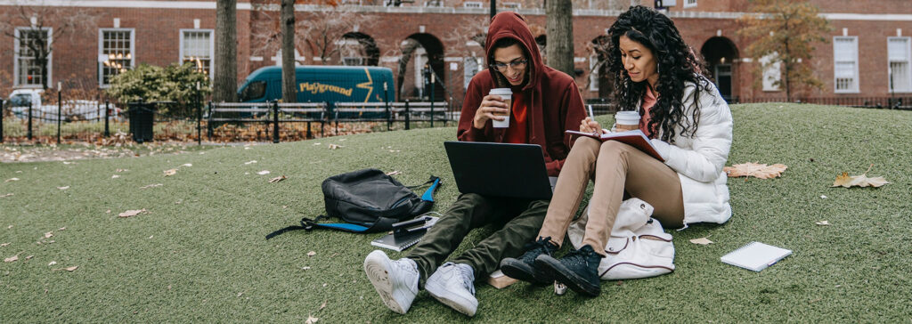 college students sitting on campus