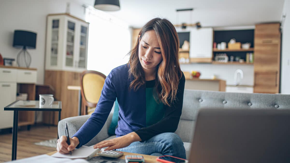 woman working on financials at home