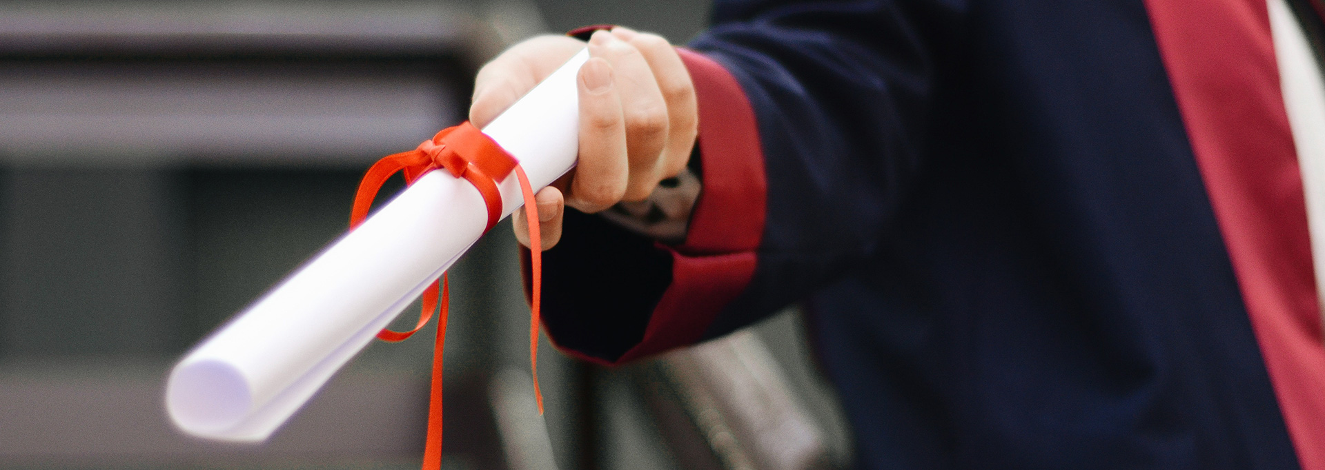 hand holding diploma