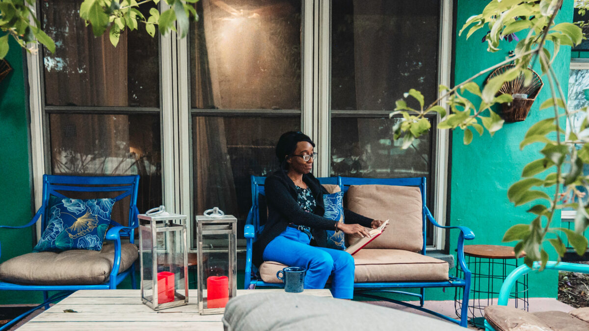 woman sitting on front porch