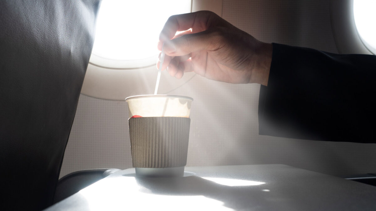 enjoying coffee on a plane